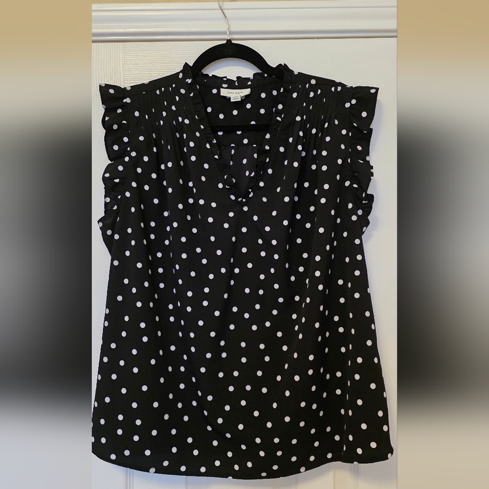 Elegant Black and White Polka Dot Blouse With Ruffle Neckline and Sleeves